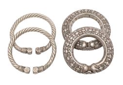 A pair of Middle Eastern silver bangles: with rope twist decoration, 12cm diameter,