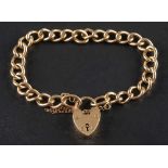A 9ct gold curb-link bracelet with heart-shaped clasp,: with hallmarks for Birmingham, 1963,