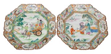 A pair of Japanese Arita famille rose octagonal chargers: with foliate barbed rims,