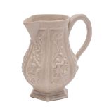 A Staffordshire white saltglaze cream jug: of octagonal baluster form with loop handle,