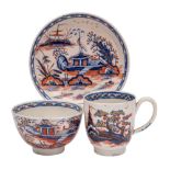 A Liverpool trio: decorated in underglaze blue and iron-red with a chinoiserie design heightened in