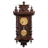 A Vienna style wall clock: the eight-day duration spring-driven movement striking the hours on a