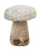 A granite staddle stone and cap,