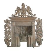 A Victorian display model or salesman's sample model of a cast brass firegrate and surround: