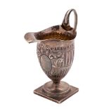 A Victorian silver cream jug, maker Charles Stuart Harris, London, 1881: of helmet-shaped outline,