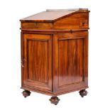 A goncalo alves Davenport in Regency style,: the top with brass three quarter gallery,