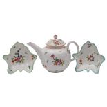 A Bristol polychrome bullet-shaped teapot and cover and a pair of similar leaf-shaped pickle dishes,