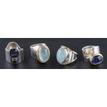 Four gemset rings,: including aquamarine, amethyst, light green chalcedony and sapphire,