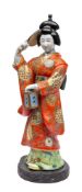 A large Japanese porcelain figure of a Bijin: wearing flowing kimono and holding a mirror and