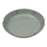 A Chinese crackle-glazed celadon dish: of shallow foliate form, 13.5cm and fitted case.