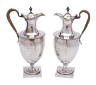 A George III silver wine ewer, maker's mark worn, London, 1776: of neoclassical outline,