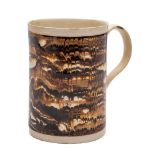 An English creamware cylindrical mug: with grooved loop handle,
