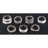 Seven modernist rings,: all rings stamped '950', two with maker's marks 'T'S', ring sizes M-P,