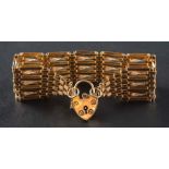 A 9ct gold, gate-link bracelet with heart-shaped clasp,: with hallmarks for London, 1968, length ca.
