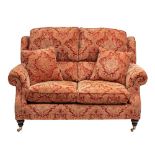 An upholstered two seat sofa by Parker Knoll, modern,: with outscrolled arms,