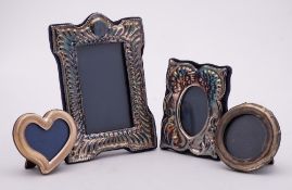 Four assorted silver photo frames,