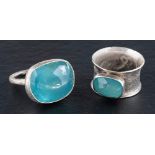 Two silver, gemset rings,: one set with a cabochon-cut aquamarine, with maker's mark 'Pe',