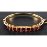 A hinged ruby and single-cut diamond bangle,: estimated total ruby weight ca.