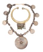 A Middle Eastern white metal necklace: with applied Maria Theresa talers,