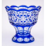 A blue flashed glass vase: of pedestal form printies, slice cut and stellar decoration,