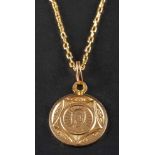 A medallion pendant and cable-link chain,