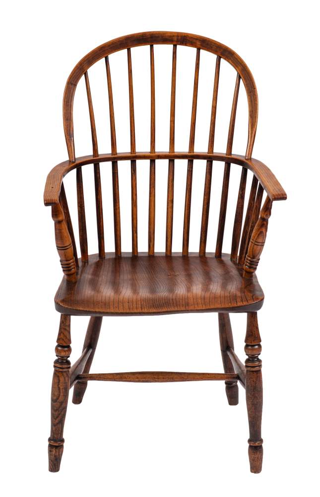 An ash and elm Windsor elbow chair, early 19th century,: with arched spindled back,