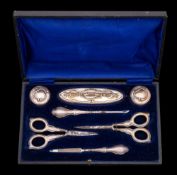 A set of six silver pistol handled butter knives: cased and a cased set of silver mounted manicure