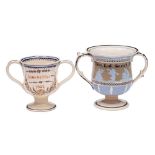 A mid 19th century creamware frog loving-cup and one other in early 19th century style: the first