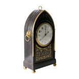 An ebonised Georgian mantel clock: having an eight-day duration single-fusee timepiece movement,