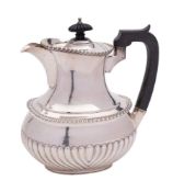 A George V silver coffee pot, maker Mappin & Webb, Sheffield, 1924: of barge-shaped outline,