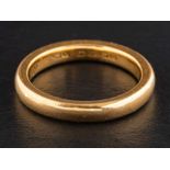 A 22ct gold band ring,: with hallmarks for Birmingham, 1928, ring size N, total weight ca. 6.7gms.