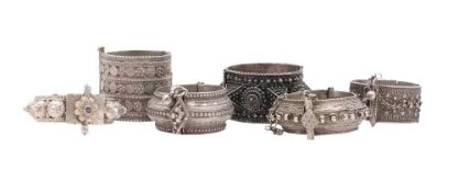 A collection of six assorted Middle Eastern silver bangles: with banded decoration, 483gms, 15.