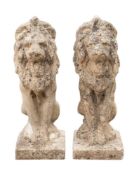 A pair of stone composition pier finials cast as sejant lions, 20th century,