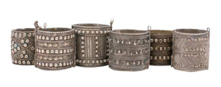 A collection of six assorted Middle Eastern silver bangles: with banded decoration, 468gms, 15ozs.
