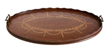 An Edwardian mahogany and inlaid gallery tray: of oval outline with inlaid foliate garland
