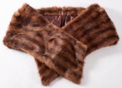 An early 20th century fur stole with silk lining.