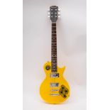 A Wesley yellow plastic Les Paul style electric guitar, plated machine heads, dot fret markers,