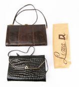A Black Crocodile skin handbag by Bidente with gold tone fixtures,
