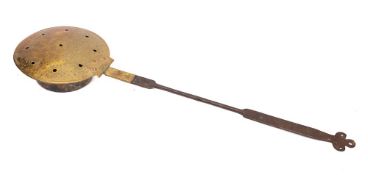 A late 18th/early 19th Century brass and copper chestnut roaster: with iron handle and trefoil