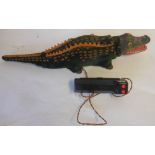 Marx, a battery operated crocodile with celluloid head, plush covered metal body with rubber fins,