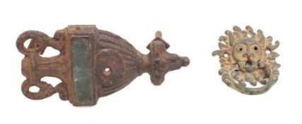 A late 18th/early 19th century iron and brass door knocker in the form of an urn,