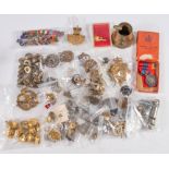 A collection of British Regimental cap badges and buttons: including Tank Regiment, RAF and others,