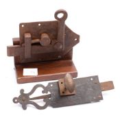 A large iron spring loaded door latch, 18th/19th century.