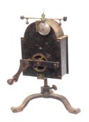 A 19th Century Continental clockwork spit engine: of domed outline with brass governor and bell