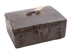 A 17th century leather bound wooden box: the top with geometric decoration and iron bail handle,