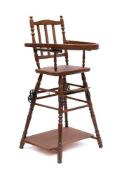 A child's beech folding high chair: the back with triple vertical splats,