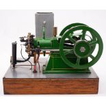 A scale model of a four stoke horizontal engine, double 6 1/2 inch six-spoked flywheels,