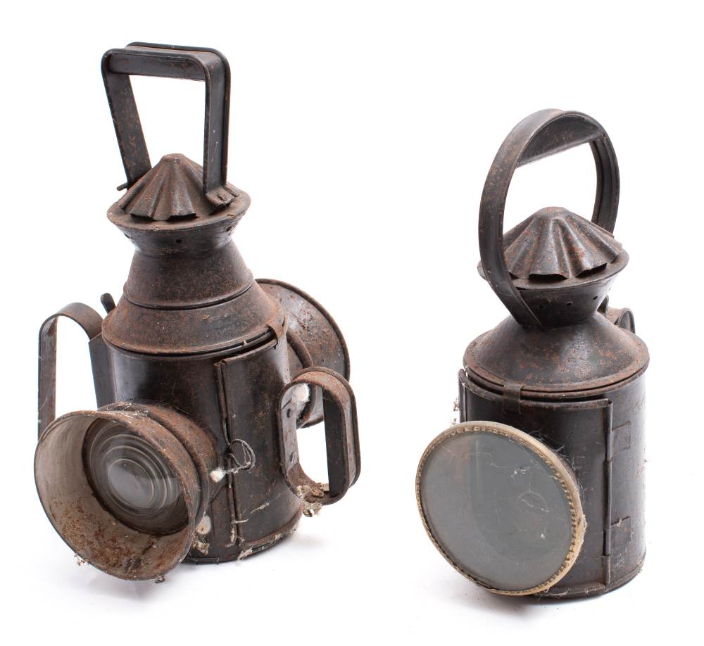 An early 20th century double lens railway hand signal lantern with original burner and two colour