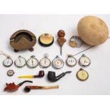 A small collection of miscellaneous collectables, including five various pipes, a pedometer,