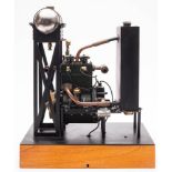 A scale model of a twin piston four stroke engine, 3 inch brass flywheel,